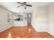 Open living area with tile flooring, light-colored walls, and a view leading to the kitchen and front entrance at 8101 Interbay Blvd # A, Tampa, FL 33616