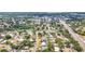 Expansive aerial view of a residential neighborhood with mature trees, lush landscaping and easy access to the main road at 8240 Quail Rd, Seminole, FL 33777