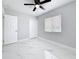 Bedroom with window, ceiling fan, and closet offers ample space and natural light at 8240 Quail Rd, Seminole, FL 33777