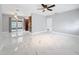 Spacious living room with bright marble floors and lots of natural light at 8240 Quail Rd, Seminole, FL 33777