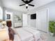 Bright main bedroom features a ceiling fan, ample closet space and an ensuite bathroom at 8240 Quail Rd, Seminole, FL 33777