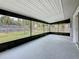 Enclosed patio offers a view of the backyard at 8240 Quail Rd, Seminole, FL 33777