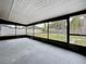 Enclosed patio offers a view of the backyard at 8240 Quail Rd, Seminole, FL 33777