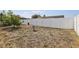 Spacious backyard with birdbath and a white fence at 8330 Moulton Dr, Port Richey, FL 34668