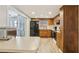 Efficient kitchen with wood cabinets and white appliances, perfect for home cooking at 8330 Moulton Dr, Port Richey, FL 34668