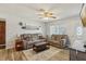Inviting living room with neutral colors, comfortable seating and wood-look flooring at 8330 Moulton Dr, Port Richey, FL 34668