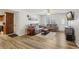 Cozy living room featuring wood-look floors and comfortable seating at 8330 Moulton Dr, Port Richey, FL 34668