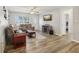 Comfortable living room with modern floors, and a TV for relaxation and entertainment at 8330 Moulton Dr, Port Richey, FL 34668