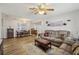 Open-concept living room with dining area, perfect for entertaining at 8330 Moulton Dr, Port Richey, FL 34668