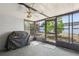 Enclosed sunroom with large windows and a grill at 8330 Moulton Dr, Port Richey, FL 34668