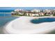 Stunning aerial view of beachfront condos with white sandy beach and blue ocean waters at 845 S Gulfview Blvd # 107, Clearwater Beach, FL 33767