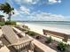 Relaxing beach view with seating available; perfect for enjoying the ocean breeze and beautiful scenery at 845 S Gulfview Blvd # 107, Clearwater Beach, FL 33767