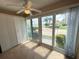 Bright bedroom with tile floors, closet and sliding glass doors leading to a patio at 845 S Gulfview Blvd # 107, Clearwater Beach, FL 33767