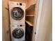 Laundry area with Bosch washer and dryer and built-in shelving at 845 S Gulfview Blvd # 107, Clearwater Beach, FL 33767