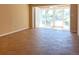 Spacious room with tile flooring and sliding glass doors, offering ample natural light at 845 S Gulfview Blvd # 107, Clearwater Beach, FL 33767