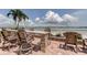 Outdoor dining area featuring seating for six and views of the intercoastal at 845 S Gulfview Blvd # 107, Clearwater Beach, FL 33767