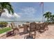 Outdoor dining area featuring seating for eight and views of the intercoastal at 845 S Gulfview Blvd # 107, Clearwater Beach, FL 33767