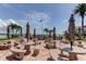 Outdoor patio with picnic tables, grill, and a view of the intercoastal and American flag at 845 S Gulfview Blvd # 107, Clearwater Beach, FL 33767