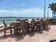 Communal beachside dining area with tall chairs at 845 S Gulfview Blvd # 107, Clearwater Beach, FL 33767