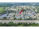An aerial view shows the home's location in a quiet neighborhood near a lake and a highway at 8915 Hannigan Ct, Tampa, FL 33626