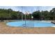 This sports complex includes a blue painted basketball court, tennis courts, and a parking area at 8915 Hannigan Ct, Tampa, FL 33626