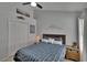 Bedroom showcasing a bed with decorative pillows, ambient lighting, and a calming decorative wall at 8915 Hannigan Ct, Tampa, FL 33626