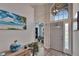 Welcoming foyer with high ceilings, decorative light fixture, hardwood floors, and views of the interior at 8915 Hannigan Ct, Tampa, FL 33626
