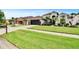 Well-manicured lawn and landscaping complement this attractive home with a two car garage and neutral color palette at 8915 Hannigan Ct, Tampa, FL 33626