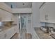 Modern kitchen with white cabinets, granite countertops, and an open layout, perfect for cooking and entertaining at 8915 Hannigan Ct, Tampa, FL 33626