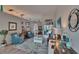 Bright living room with comfortable armchairs, a stylish rug, and access to the outdoor pool area at 8915 Hannigan Ct, Tampa, FL 33626