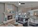 Spacious living area featuring a fireplace, comfortable seating, and views of the pool area through large windows at 8915 Hannigan Ct, Tampa, FL 33626