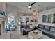 Open-concept living space with comfortable seating, a fireplace, and seamless flow to the kitchen and dining areas at 8915 Hannigan Ct, Tampa, FL 33626
