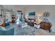 Cozy living room features comfortable seating, stylish furnishings, and sliding doors to the outdoor area at 8915 Hannigan Ct, Tampa, FL 33626
