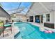 Gorgeous screened-in pool area with ample seating for relaxation and entertainment at 8915 Hannigan Ct, Tampa, FL 33626