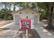 Small community restroom with free library sitting in front of building at 8915 Hannigan Ct, Tampa, FL 33626