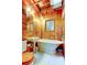 This bathroom boasts warm wood paneling, a vintage sink, and a clawfoot tub at 919 Sandpiper S Way, St Petersburg, FL 33707