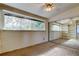 Carpeted bedroom with built-in shelving and a mirrored closet at 919 Sandpiper S Way, St Petersburg, FL 33707