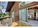 Exterior view showing a wood-sided home with balcony and sliding glass doors at 919 Sandpiper S Way, St Petersburg, FL 33707