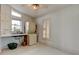 Bright laundry room features tile floors, washer/dryer, sink, cabinets, and window for natural light at 919 Sandpiper S Way, St Petersburg, FL 33707
