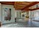Open-concept living space with wood ceilings, tile floors, and natural light at 919 Sandpiper S Way, St Petersburg, FL 33707