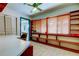 Bright office features built-in shelving and natural light at 919 Sandpiper S Way, St Petersburg, FL 33707