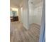 Bright bathroom with dual sinks, soaking tub, and walk-in closet with built-in shelving at 11240 Marvelwood, Brooksville, FL 34614