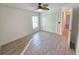 Bedroom with ceiling fan, closet with bi-fold doors, and wood-look tile flooring at 11240 Marvelwood, Brooksville, FL 34614