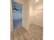 Walk-in closet with wire shelving and a view of the primary bedroom at 11240 Marvelwood, Brooksville, FL 34614