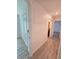 Hallway with tile flooring and access to the bathroom and bedroom at 11240 Marvelwood, Brooksville, FL 34614