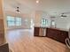 Open concept kitchen with stainless steel appliances and wooden cabinetry connected to the dining area at 11240 Marvelwood, Brooksville, FL 34614