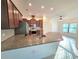 Bright kitchen with granite countertops, stainless appliances and tiled backsplash at 11240 Marvelwood, Brooksville, FL 34614