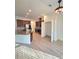 Spacious kitchen with stainless steel appliances, wooden cabinetry, and an island with granite countertops at 11240 Marvelwood, Brooksville, FL 34614