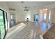 Bright and airy living room with light tile flooring and access to the kitchen at 11240 Marvelwood, Brooksville, FL 34614