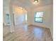 Bright living room with neutral walls and clear sight lines through the home at 11240 Marvelwood, Brooksville, FL 34614